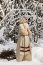 Russian girl in the winter woods Royalty Free Stock Photo