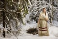 Russian girl in the winter woods Royalty Free Stock Photo