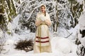Russian girl in the winter woods Royalty Free Stock Photo