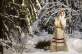 Russian girl in the winter woods Royalty Free Stock Photo