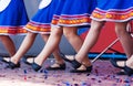 Russian girls in traditional costumes dancing on stage