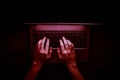 Russian hacker hacking the server in the dark web, Deep Web, Red Tinting, Top view Royalty Free Stock Photo