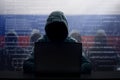 Russian hacker at laptop. Malware and virus