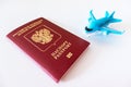 Russian international passport and a blue plane on white background. Travel, journey and flying concept Royalty Free Stock Photo