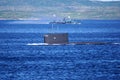 A Russian Kilo Class diesel-electric submarine is diving in Kola Bay, Russia.