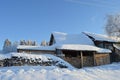 Russian log hut with firewood harvested for winter Royalty Free Stock Photo