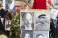 Russian man with portraits of Stalin and Lenin Royalty Free Stock Photo