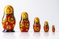 Russian matryoshka dolls on a row on white isolated studio background. With copy space fot text