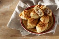 Russian meat piroshki. Traditional hand mini pies on wooden background