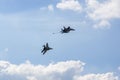 Russian MiG-29 multirole fighter jet and NATO-Fulcrum MiG-35 fighter jet demonstrate aerial refueling over airfield of Gromov Royalty Free Stock Photo