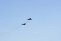 Russian MiG-29 multirole fighter jet and NATO-Fulcrum MiG-35 fighter jet demonstrate aerial refueling over airfield of Gromov Royalty Free Stock Photo