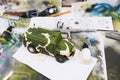 Russian military armored camouflage jeep Tiger. Plastic scale model on working space