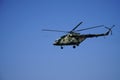 Russian military helicopter in flight on clear blue sky background Royalty Free Stock Photo