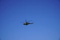 Russian military helicopter in flight on clear blue sky background Royalty Free Stock Photo