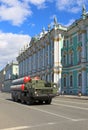 Russian military vehicles going down the street to a rehearsal o