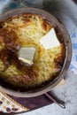 Russian millet porridge with butter in a ceramic dish out of the oven