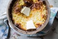 Russian millet porridge with butter in a ceramic dish out of the oven