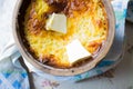 Russian millet porridge with butter in a ceramic dish out of the oven