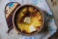 Russian millet porridge with butter in a ceramic dish out of the oven