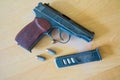 Russian 9mm handgun PM Makarov on the table with holster, belt and empty pistol holder Royalty Free Stock Photo