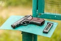 Russian 9mm handgun PM Makarov on the table with holster, belt and empty pistol holder