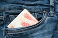 Russian money roubles in blue jeans pocket as a top view image Royalty Free Stock Photo