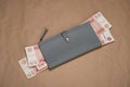 Women`s wallet with Russian rubles. Russian money bills in a gray wallet Royalty Free Stock Photo