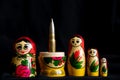 Russian nesting doll with a bullet inside, Russian aggressive culture, war in Ukraine with Russians Royalty Free Stock Photo