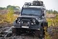 Russian off road car UAZ in mud Royalty Free Stock Photo