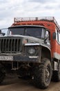 Russian off-road expedition truck Ural driving on mountain road, transportation tourists and travelers in direction travel destina Royalty Free Stock Photo