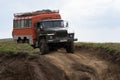 Russian off-road extreme expedition truck Ural driving on mountain road, transportation tourists