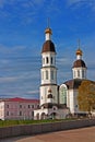 Russian Orthodox church with three domes against blue sky