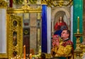 Russian Orthodox priest in traditional clothing serving in the Saint Isaac`s Russian Orthodox Cathedral in Saint Petersburg Russi