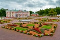 Russian palace and symmetrical gardens with a multitude of flowers and green plants. Tallinn