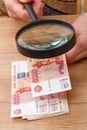 Russian paper money and magnifier Royalty Free Stock Photo