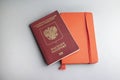 Russian pasport and red note book on grey background Royalty Free Stock Photo