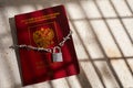 Russian passport chained in a chain with a padlock is located. Prohibition of Schengen visas for Russian tourists. Royalty Free Stock Photo