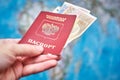 Russian passport and Euro banknotes on the map background Royalty Free Stock Photo