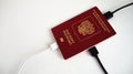 Russian passport for foreign currency into which the charger cable is plugged