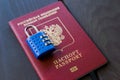 Russian passport locked to padlock. Symbol of anti-Russian sanctions Royalty Free Stock Photo