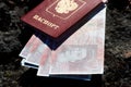 Russian passport with money in British pounds sterling Royalty Free Stock Photo