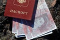 Russian passport with money in British pounds sterling Royalty Free Stock Photo