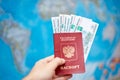 Russian passport with ruble banknotes on the background of the world map Royalty Free Stock Photo