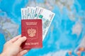 Russian passport with ruble banknotes on the background of the world map Royalty Free Stock Photo