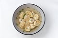 Russian pelmeni in a grey plate on a white background