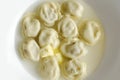 Russian pelmeni meat Dumplings with butter Royalty Free Stock Photo