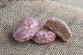 Russian pink chocolate gingerbreads on a sackcloth napkin, rustic bacground