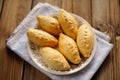 Russian pirogi, small pies on blue linen