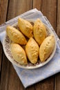 Russian pirogi, small pies on blue linen