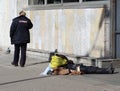 Russian police calls the outfit to the body of a dead homeless man at the wall of the metro station